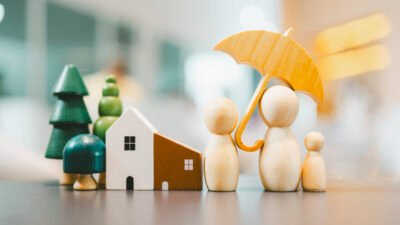 Umbrella icon and family model, Security protection and health insurance. The concept of family home, protection, health care day, car insurance.